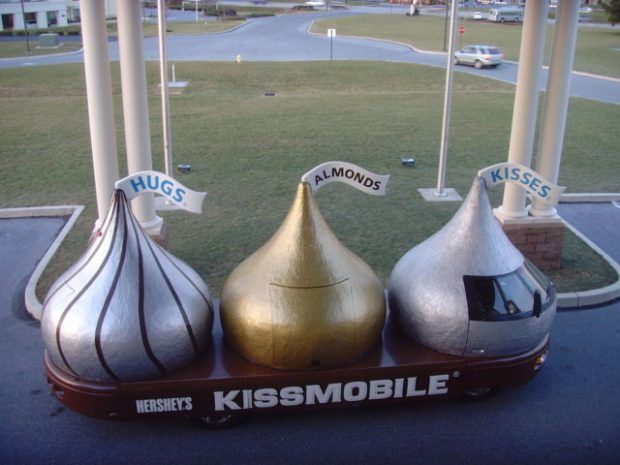 Giant Hershey Kisses sitting on a "Kissmobile"