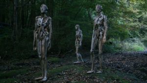 creepy wood statues